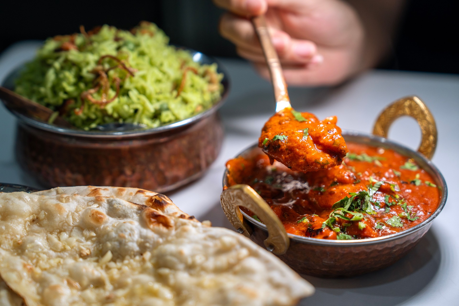 Indian Butter Chicken Curry served together with garlic naan and basmati rice.