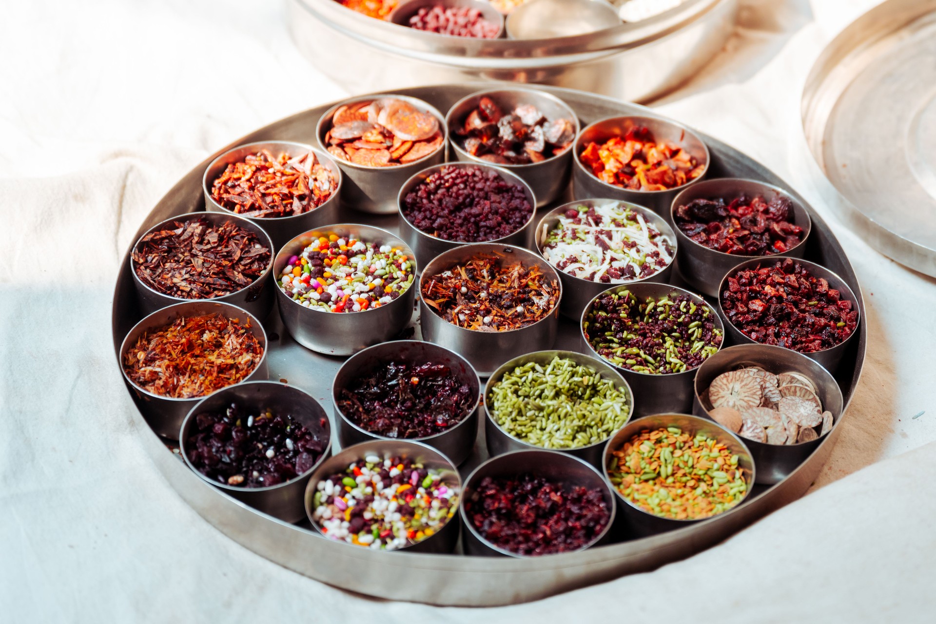 plate with colorful variation of herbs, seeds and spices